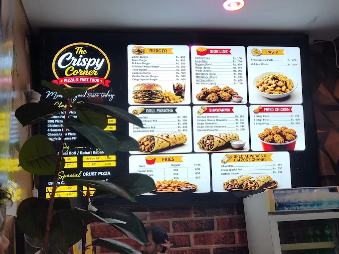 The Crispy Corner restaurant sign and menu board